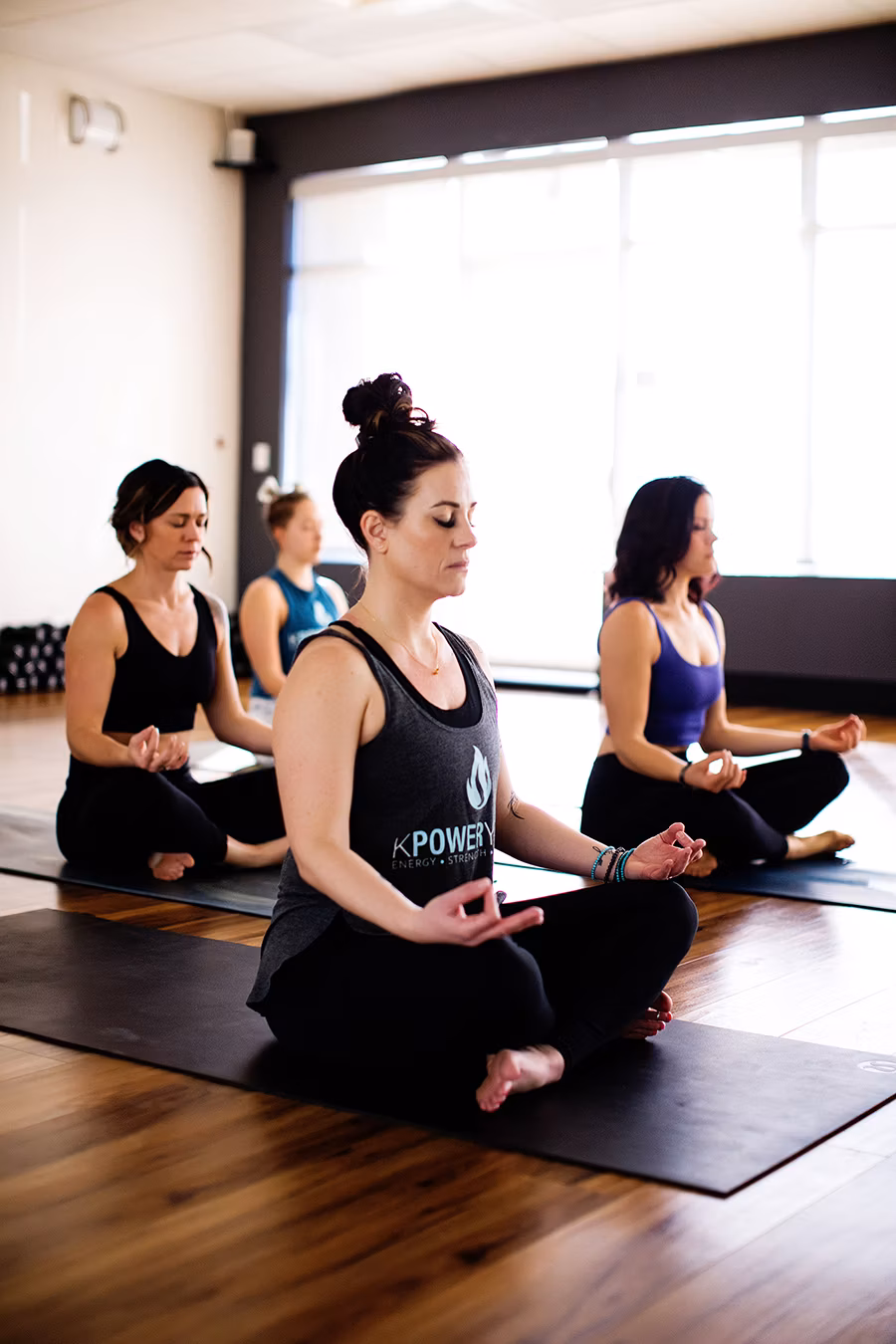 A supported restorative stretch during class