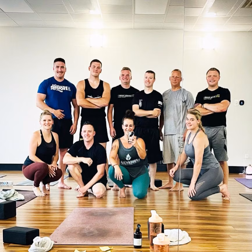 Community Heroes class — servicemembers and members in a post-class mirror photo