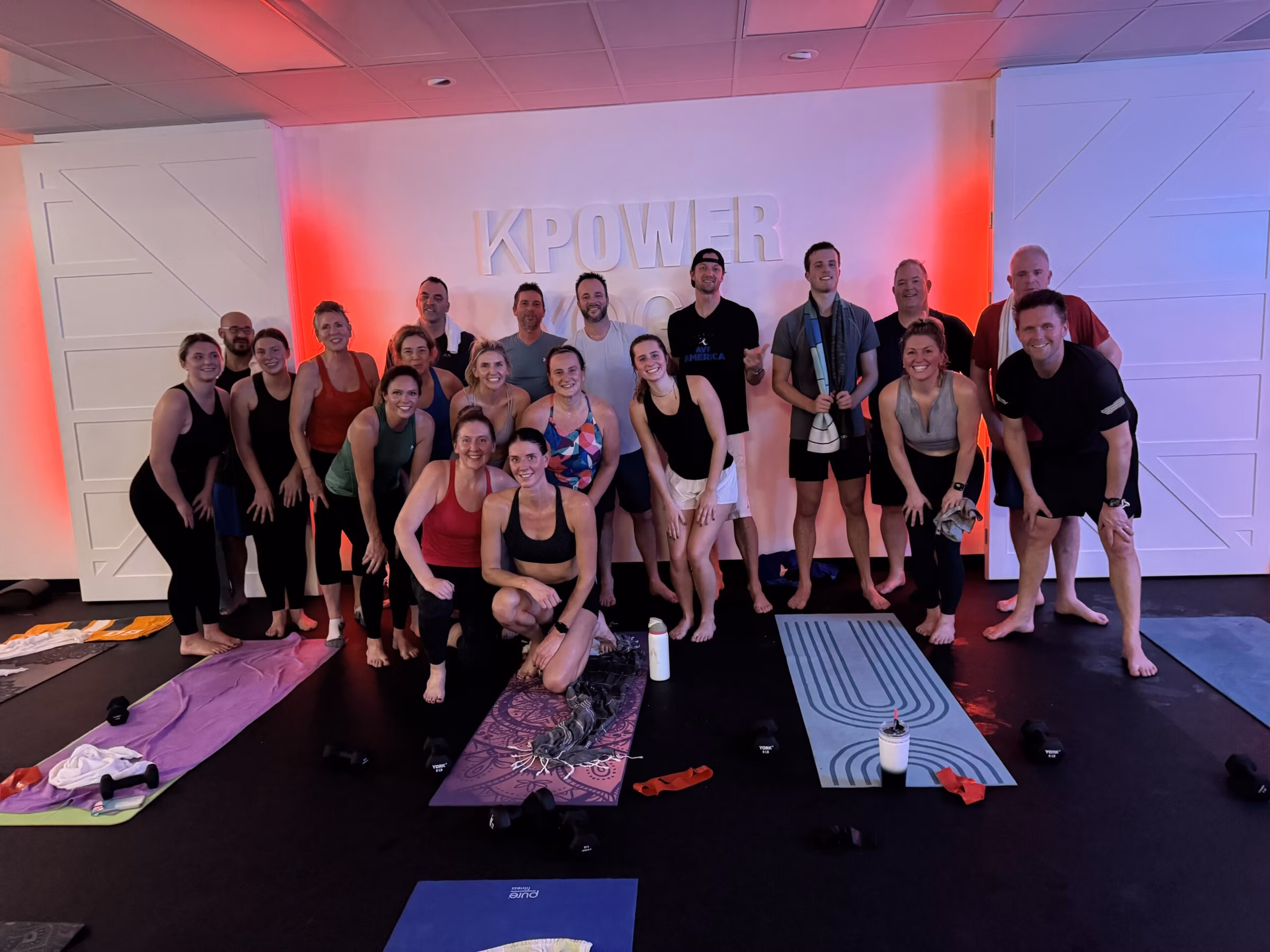 A sweaty post-class group photo in the Rogers hot room